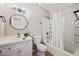 Bathroom featuring a shower and tub combination with a shower curtain and a clean white vanity at 1307 E Broadmor Dr, Tempe, AZ 85282