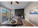 Dining room with modern table setting, a brick fireplace, and a sliding glass door at 1307 E Broadmor Dr, Tempe, AZ 85282