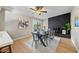 Stylish dining room featuring modern furnishings, a decorative brick fireplace, and natural light at 1307 E Broadmor Dr, Tempe, AZ 85282