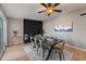 Open dining area with a modern table, black brick fireplace, and sliding glass doors at 1307 E Broadmor Dr, Tempe, AZ 85282