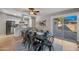 Inviting dining room with outdoor access, a modern table setting, and an adjacent kitchen at 1307 E Broadmor Dr, Tempe, AZ 85282