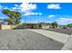 Well maintained tan brick home with desert landscaping and a covered carport at 1307 E Broadmor Dr, Tempe, AZ 85282