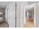 Bright hallway with multiple storage closets and hardwood floors at 1307 E Broadmor Dr, Tempe, AZ 85282