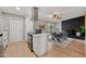Modern kitchen with stainless steel appliances and breakfast bar at 1307 E Broadmor Dr, Tempe, AZ 85282