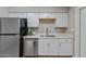 Clean and modern kitchen with stainless steel appliances and white cabinets at 1307 E Broadmor Dr, Tempe, AZ 85282