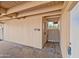 Covered back patio area with a door to backyard and covered ceiling at 1307 E Broadmor Dr, Tempe, AZ 85282