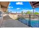 Backyard featuring a sparkling pool surrounded by a safety fence and plenty of space to relax at 1307 E Broadmor Dr, Tempe, AZ 85282