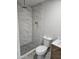 Newly renovated bathroom with marble tile shower and modern fixtures at 15445 N Verde St, Surprise, AZ 85378