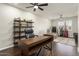 The home office features hardwood floors, a ceiling fan, a desk, and a recliner at 15501 W Camino Real Way, Surprise, AZ 85374