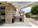 Outdoor grilling area with a built-in grill and counter space, ideal for outdoor cooking at 15501 W Camino Real Way, Surprise, AZ 85374