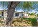 Relaxing backyard with a brick patio, lounge chairs, and lush greenery offers a serene outdoor space at 15614 N Lakeforest Dr, Sun City, AZ 85351