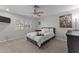 Cozy bedroom with carpet, window, ceiling fan, and comfortable decor at 15614 N Lakeforest Dr, Sun City, AZ 85351