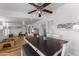 Open dining area showcasing a large wooden table and access to bonus room at 15614 N Lakeforest Dr, Sun City, AZ 85351