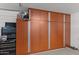 Organized garage with built-in storage cabinets and a tool chest, providing ample space for equipment and projects at 15614 N Lakeforest Dr, Sun City, AZ 85351