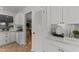 Well-designed kitchen showcasing white cabinets, modern appliances, and a convenient layout for everyday living at 15614 N Lakeforest Dr, Sun City, AZ 85351