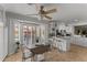 Bright kitchen with tile floors, breakfast bar, light cabinets and a cozy dining area with bay window at 15614 N Lakeforest Dr, Sun City, AZ 85351