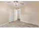 A typical bedroom with hardwood floors, light walls, and access to other rooms at 15849 N 46Th Pl, Phoenix, AZ 85032