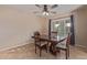 Formal dining room featuring a classic wood table set and plantation shutters on the window at 15849 N 46Th Pl, Phoenix, AZ 85032
