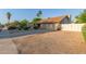 Charming single-story home with desert landscaping, spacious driveway and white gate at 15849 N 46Th Pl, Phoenix, AZ 85032