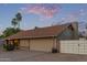 Charming single-story home with desert landscaping, spacious driveway and white gate at 15849 N 46Th Pl, Phoenix, AZ 85032