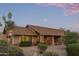 Inviting home with desert landscaping, mature bushes, and charming brick accents at 15849 N 46Th Pl, Phoenix, AZ 85032