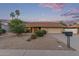 Charming single-story home with desert landscaping, palm trees, and a two-car garage at 15849 N 46Th Pl, Phoenix, AZ 85032