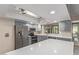 Well-equipped kitchen boasts stainless steel appliances and a spacious island with countertop seating at 15849 N 46Th Pl, Phoenix, AZ 85032