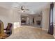 Bright living room with tile floors, a ceiling fan, and an open floor plan at 15849 N 46Th Pl, Phoenix, AZ 85032