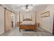 Relaxing primary bedroom with a four-poster bed, stylish lighting, and an ensuite bathroom at 15849 N 46Th Pl, Phoenix, AZ 85032