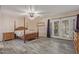 Serene primary bedroom showcasing a four-poster bed and direct access to the outdoors at 15849 N 46Th Pl, Phoenix, AZ 85032
