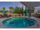 Inviting backyard pool area with a shaded pergola, lounge chairs, and meticulously landscaped surroundings at 15849 N 46Th Pl, Phoenix, AZ 85032