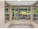 Bright sunroom with floor-to-ceiling windows offering views of the backyard and pool area at 15849 N 46Th Pl, Phoenix, AZ 85032