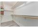 This is a simple but spacious walk-in closet with shelves and hanging rods at 15849 N 46Th Pl, Phoenix, AZ 85032