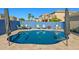 Backyard pool surrounded by patio, with seating area, great for outdoor relaxation and enjoyment at 16396 W Fillmore St, Goodyear, AZ 85338