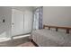 Bedroom with a window view, carpet, and sliding closet doors at 16396 W Fillmore St, Goodyear, AZ 85338
