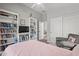 Bedroom with bookshelves and a sliding door closet at 16396 W Fillmore St, Goodyear, AZ 85338