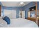 Primary bedroom featuring a four-poster bed, dresser, and closet at 16396 W Fillmore St, Goodyear, AZ 85338