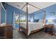 The primary bedroom features a four poster bed, view, and two side tables at 16396 W Fillmore St, Goodyear, AZ 85338