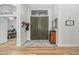 Inviting entryway with wood floors and a stylish rug leading to double doors at 16396 W Fillmore St, Goodyear, AZ 85338