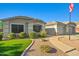 Inviting single-story home with well-manicured lawn and a charming walkway to the garage at 16396 W Fillmore St, Goodyear, AZ 85338