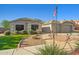 Inviting home with well-maintained yard, walkway, and an American flag waving in the breeze at 16396 W Fillmore St, Goodyear, AZ 85338