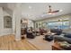 Cozy living room with comfortable seating, a piano, and natural light from the windows at 16396 W Fillmore St, Goodyear, AZ 85338