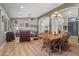 Open concept living room with hardwood floors, comfortable seating, and stylish chandelier at 16396 W Fillmore St, Goodyear, AZ 85338