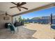 Covered patio featuring ceiling fans overlooking a spacious paved area, ideal for outdoor entertainment at 16396 W Fillmore St, Goodyear, AZ 85338