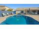 Backyard pool with landscaping and patio area offering a relaxing outdoor space at 16396 W Fillmore St, Goodyear, AZ 85338