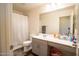 Bathroom featuring a shower, gray vanity, and plenty of storage at 16425 W Latham St, Goodyear, AZ 85338