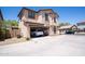 Two story home with a two car garage and large driveway at 16425 W Latham St, Goodyear, AZ 85338
