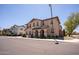 Attractive two-story townhome with well-manicured landscaping and a welcoming entrance at 16425 W Latham St, Goodyear, AZ 85338