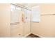 Walk-in shower with clear glass and tile floors at 16425 W Latham St, Goodyear, AZ 85338