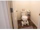 Toilet room with tile floors, white walls, and a toilet at 16425 W Latham St, Goodyear, AZ 85338
